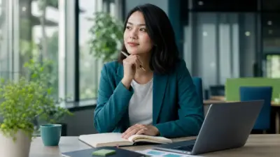 Profesional muda di awal karier menutup laptop untuk menjaga batas sehat dan mencegah stres kerja berlebihan